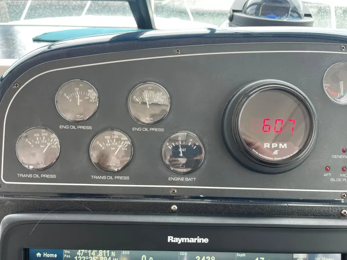  Yacht Photos Pics Dashboard of a 2003 Tiara Yachts 3500 Open, showing engine gauges and RPM display.
