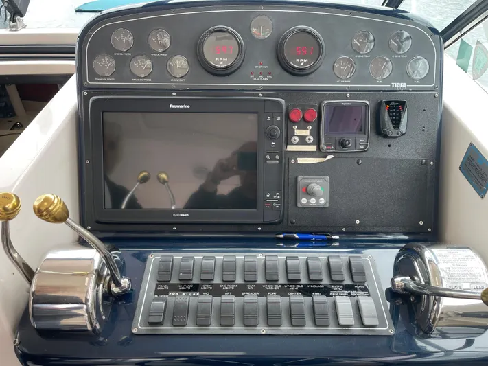  Yacht Photos Pics Control panel of a 2003 Tiara Yachts 3500 Open with navigation and engine controls.