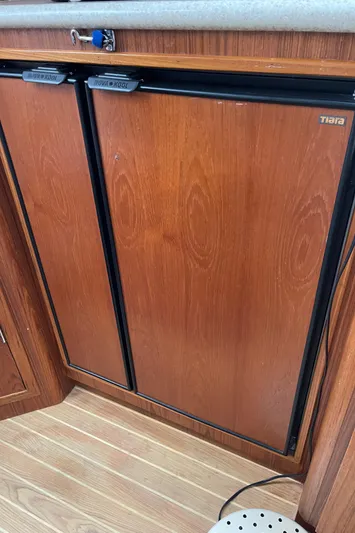  Yacht Photos Pics 2003 Tiara Yachts 3500 Open wooden cabinet interior detail.