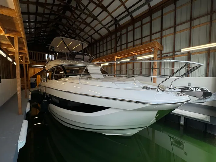  Yacht Photos Pics 2020 Prestige 420 yacht docked in a covered marina, showcasing sleek design and modern features.