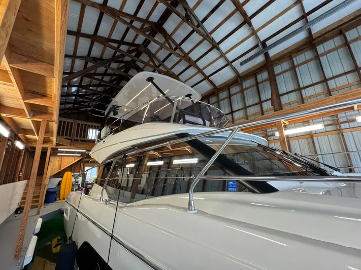  Yacht Photos Pics 2020 Prestige 420 yacht in a wooden boathouse, showcasing sleek design and modern features.