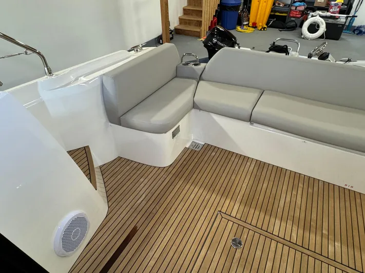  Yacht Photos Pics 2020 Prestige 420 yacht interior with gray seating and wooden flooring.