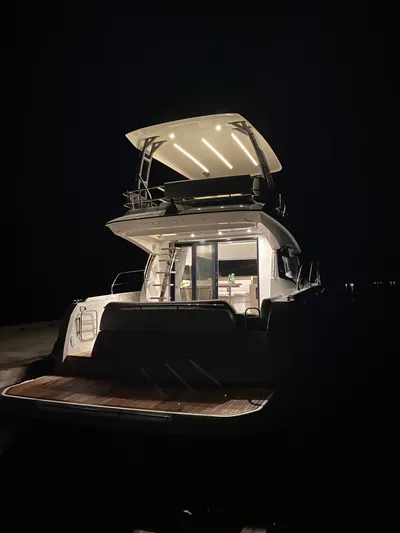  Yacht Photos Pics 2020 Prestige 420 yacht illuminated at night, showcasing modern design and elegance.