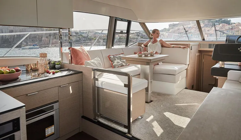  Yacht Photos Pics Luxurious interior of 2020 Prestige 420 yacht with elegant seating and dining area.