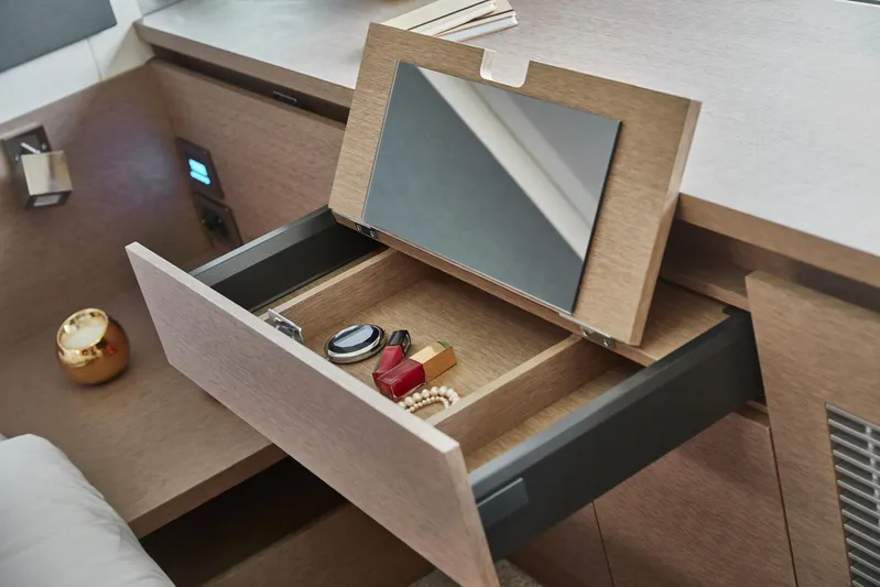  Yacht Photos Pics Luxurious Prestige 420 yacht interior with open drawer, mirror, and accessories, 2020 model.