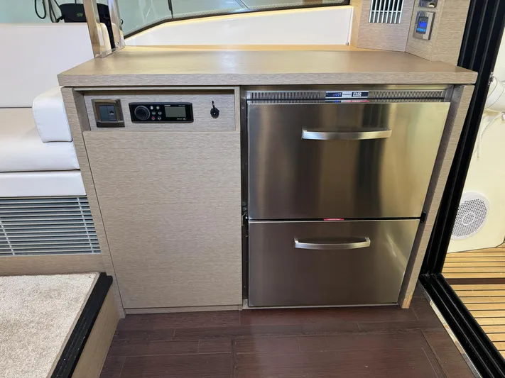  Yacht Photos Pics Modern kitchen area on a 2020 Prestige 420 yacht with stainless steel appliances.