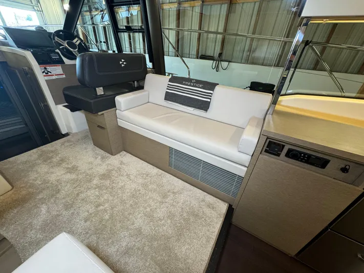  Yacht Photos Pics Luxurious interior of a 2020 Prestige 420 yacht with plush seating and modern design.
