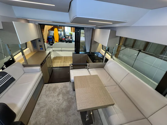  Yacht Photos Pics Luxurious interior of a 2020 Prestige 420 yacht with modern seating and dining area.