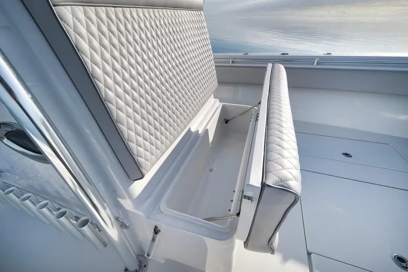  Yacht Photos Pics 2021 Contender 39 ST boat with diamond-stitched seating and storage compartment.