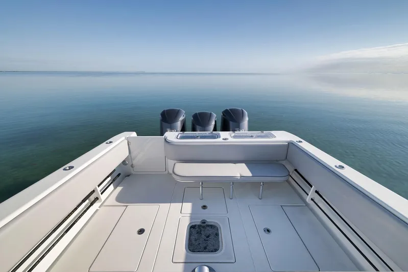  Yacht Photos Pics 2021 Contender 39 ST boat with triple engines on calm water.