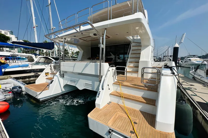  Yacht Photos Pics Luxury ILIAD 50 yacht docked at marina, showcasing elegant design and spacious deck, 2022 model.