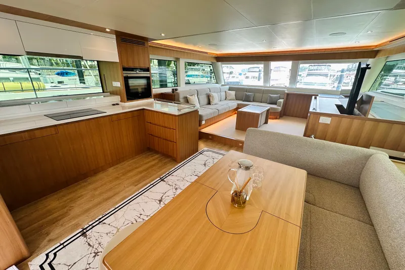  Yacht Photos Pics Luxurious interior of 2022 ILIAD 50 yacht with modern kitchen and spacious seating area.