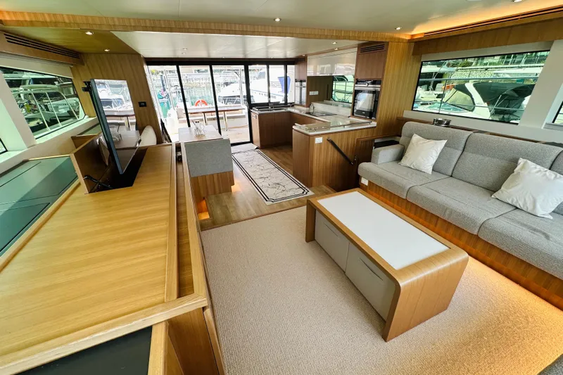  Yacht Photos Pics Luxurious interior of 2022 ILIAD 50 yacht with modern furnishings and large windows.