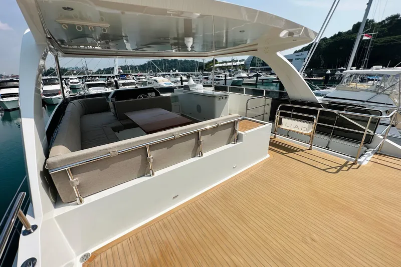  Yacht Photos Pics Luxurious ILIAD 50 yacht deck with seating area, docked at marina, 2022 model.