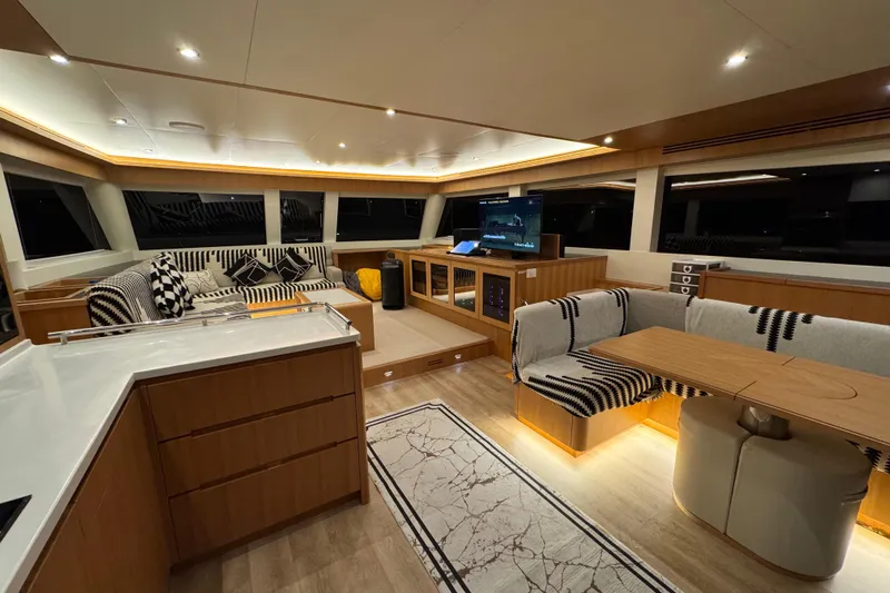  Yacht Photos Pics Luxurious interior of 2022 ILIAD 50 yacht with modern furnishings and ambient lighting.
