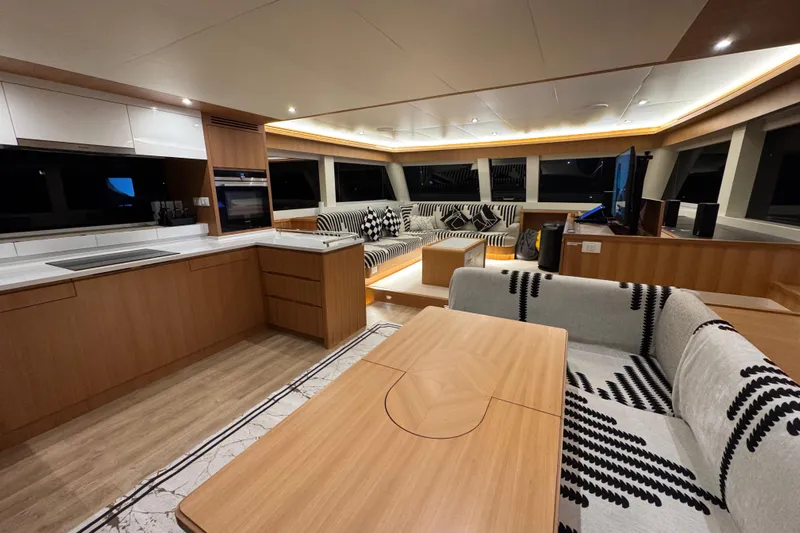  Yacht Photos Pics Luxurious interior of 2022 ILIAD 50 yacht with modern kitchen and spacious seating area.