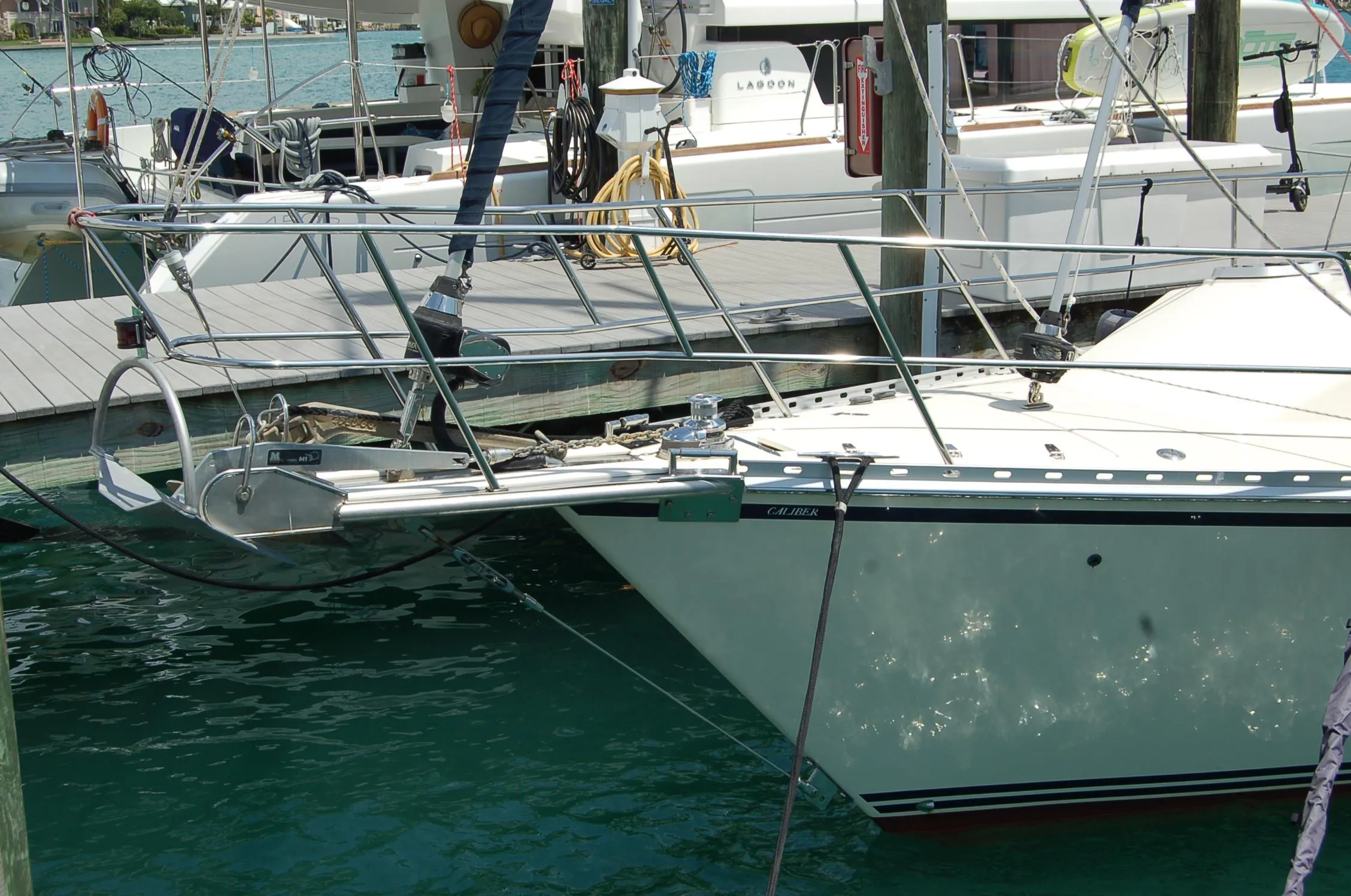 2005 Caliber 40 LRC SE sailboat docked at marina, featuring sleek design and sturdy build.