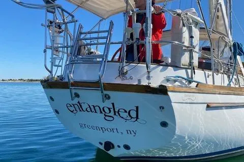 Entangled Yacht Photos Pics Sailboat "Entangled" docked in calm waters, Greenport, NY, Shannon 43, 1988 model.