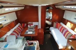  Yacht Photos Pics Interior of 2010 Dufour 45E Performance yacht with cozy seating and dining area.