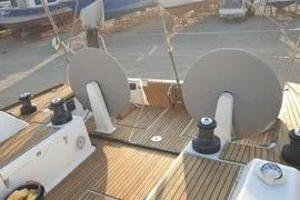  Yacht Photos Pics Dufour 45E Performance 2010 yacht deck with dual steering wheels and teak finish.