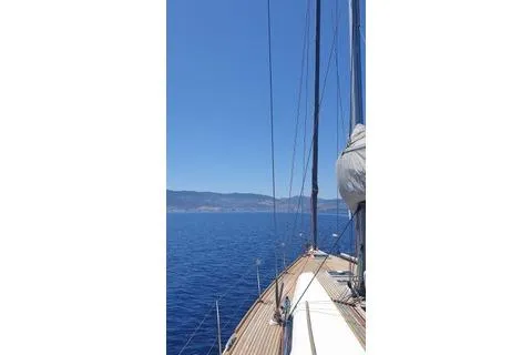  Yacht Photos Pics Sailing on a 2010 Dufour 45E Performance yacht in clear blue waters.