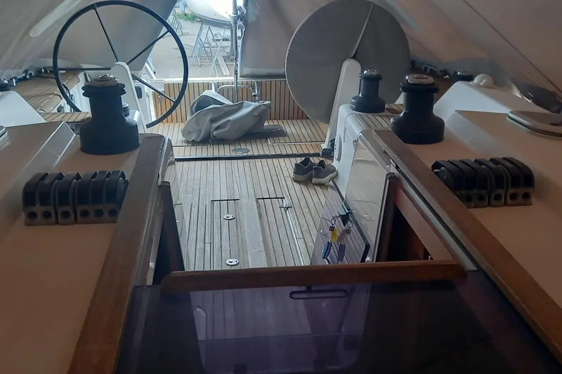  Yacht Photos Pics Cockpit of 2010 Dufour 45E Performance sailboat with wooden deck and steering wheel.