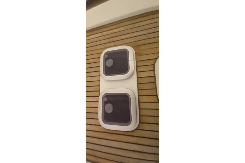  Yacht Photos Pics Deck hatches on 2010 Dufour 45E Performance yacht, featuring wooden slats.