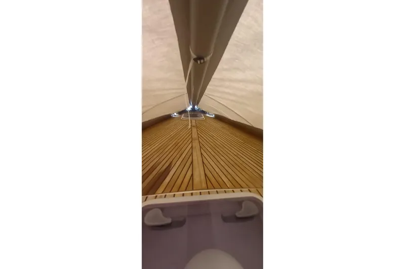  Yacht Photos Pics Dufour 45E Performance 2010 yacht deck with wooden finish under sail cover.