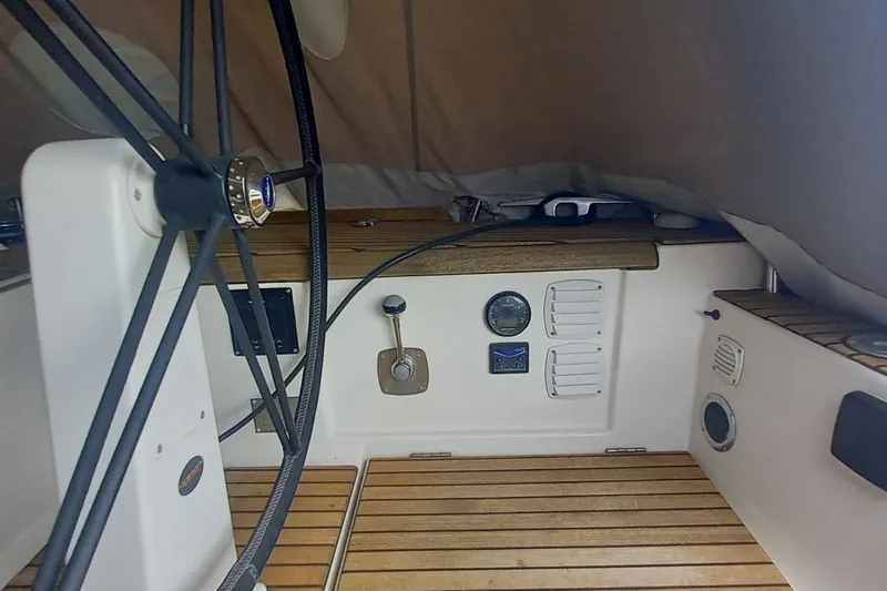 Yacht Photos Pics Cockpit of 2010 Dufour 45E Performance yacht with steering wheel and control panel.