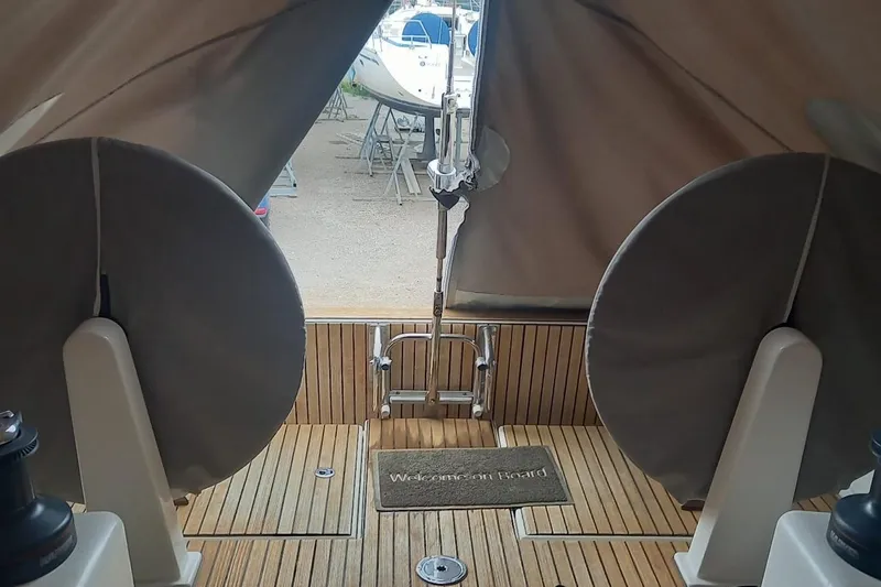  Yacht Photos Pics Dufour 45E Performance 2010 yacht interior with wooden deck and covered equipment.