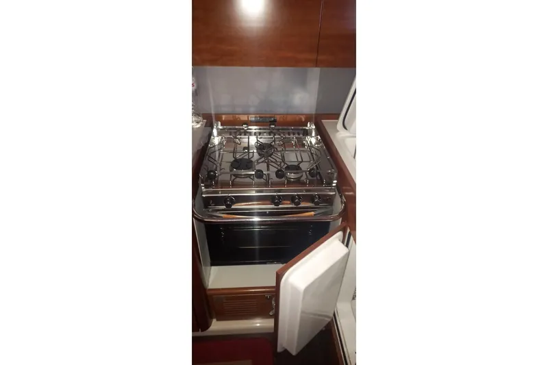  Yacht Photos Pics Galley kitchen in 2010 Dufour 45E Performance yacht with stove and oven.