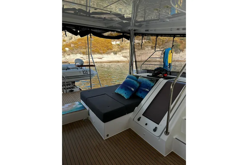 Chicago Yacht Photos Pics Luxurious 2020 Lagoon 52 F yacht interior with comfortable seating and scenic water view.