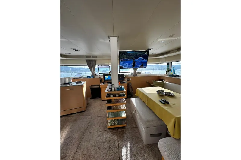 Chicago Yacht Photos Pics Luxurious interior of 2020 Lagoon 52 F yacht with dining area and panoramic windows.