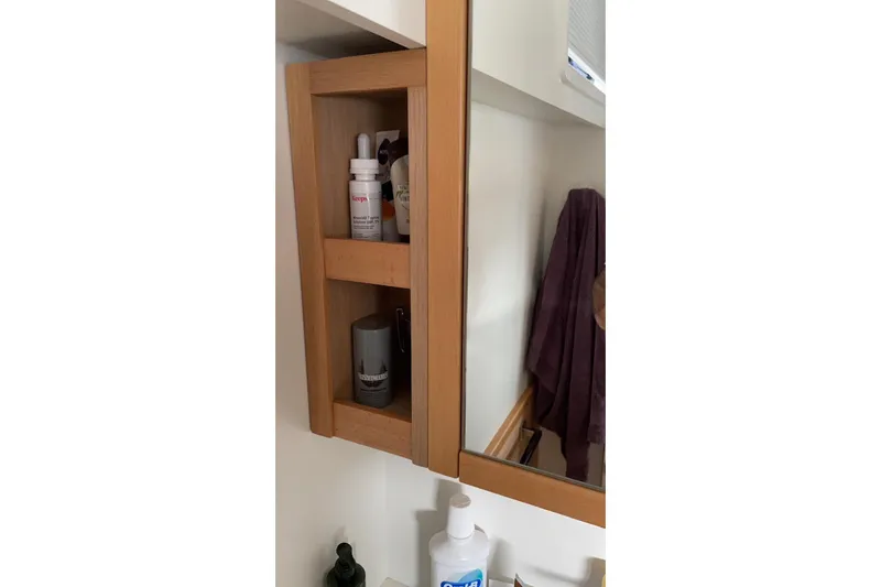 Chicago Yacht Photos Pics Wooden bathroom cabinet with toiletries on a Lagoon 52 F, 2020 model.