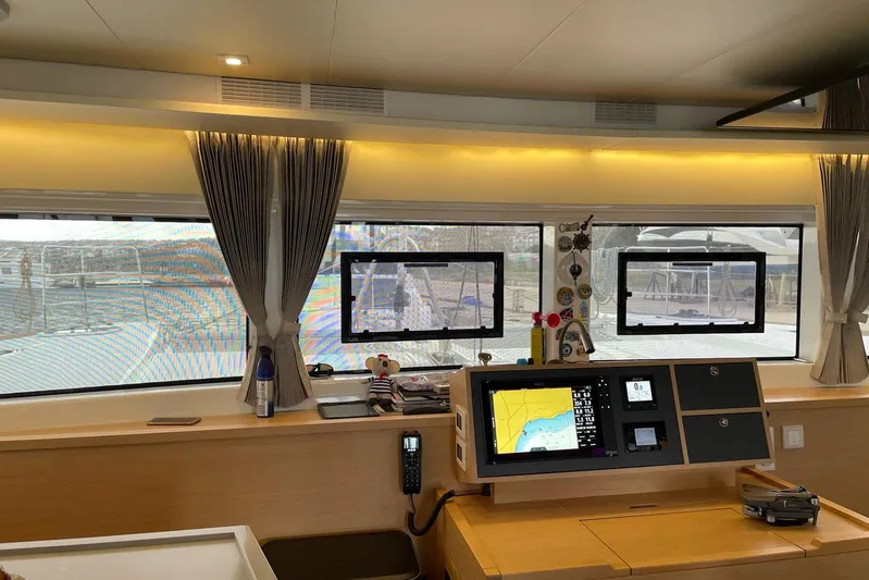 Chicago Yacht Photos Pics Interior of 2020 Lagoon 52 F yacht with navigation equipment and large windows.