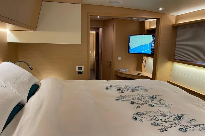 Chicago Yacht Photos Pics Luxurious cabin interior of 2020 Lagoon 52 F yacht with elegant bedding and modern amenities.