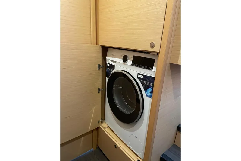 Chicago Yacht Photos Pics Washing machine inside 2020 Lagoon 52 F yacht's wooden cabinet.