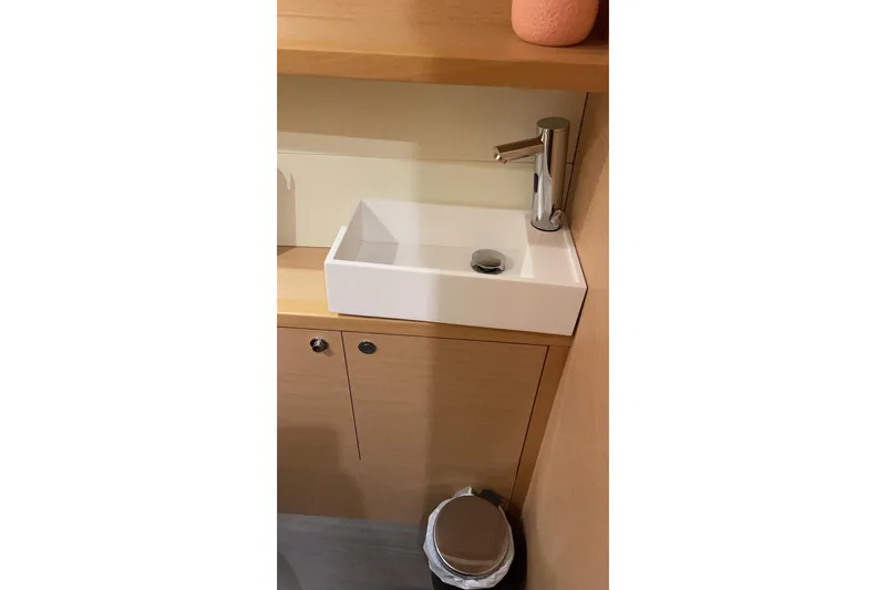 Chicago Yacht Photos Pics Modern bathroom sink in 2020 Lagoon 52 F yacht, featuring sleek design and chrome faucet.