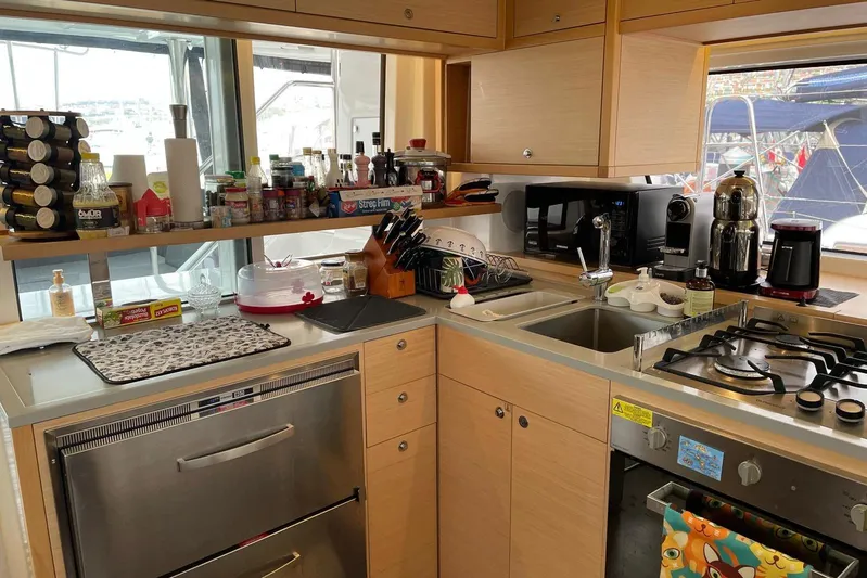 Chicago Yacht Photos Pics Modern kitchen in 2020 Lagoon 52 F yacht with appliances and utensils.