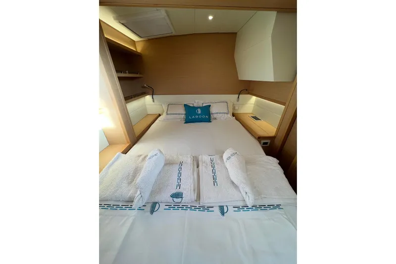 Chicago Yacht Photos Pics Luxurious cabin interior of 2020 Lagoon 52 F yacht with neatly arranged bedding.