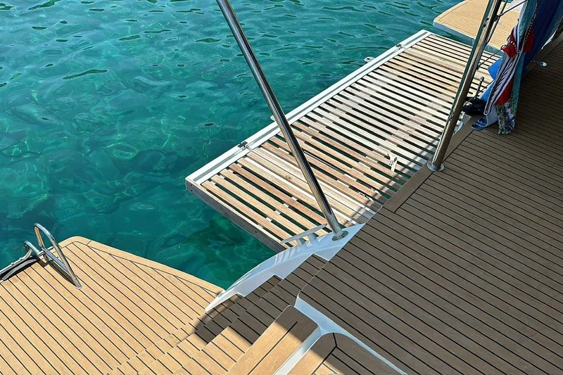 Chicago Yacht Photos Pics Lagoon 52 F 2020 yacht deck with wooden finish and clear blue water.