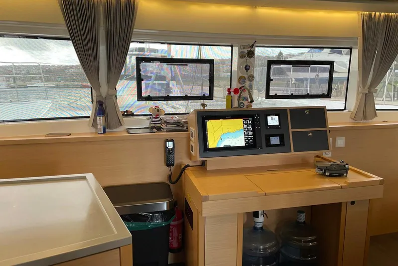Chicago Yacht Photos Pics Interior of 2020 Lagoon 52 F yacht with navigation equipment and large windows.