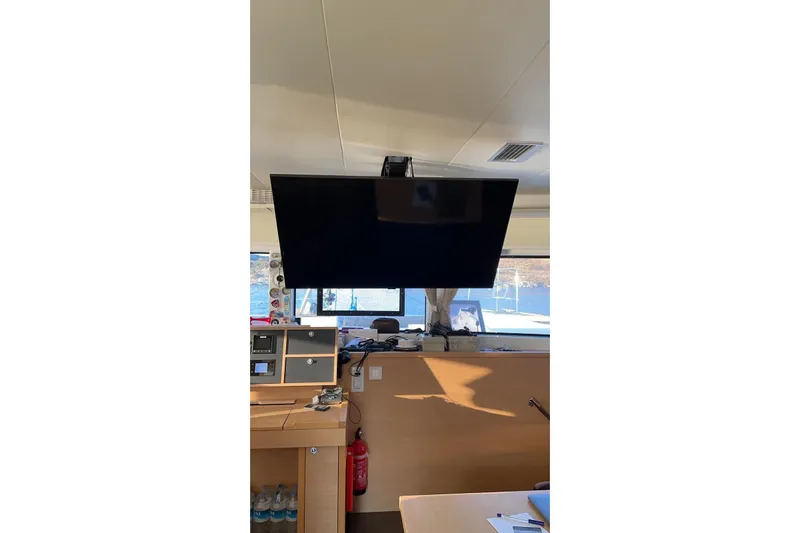 Chicago Yacht Photos Pics Interior of 2020 Lagoon 52 F yacht with mounted TV and navigation equipment.