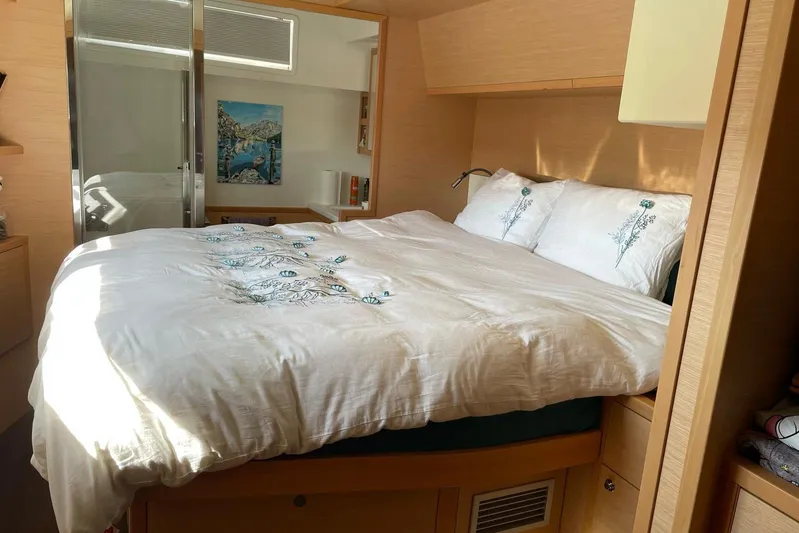 Chicago Yacht Photos Pics Luxurious bedroom interior of 2020 Lagoon 52 F yacht with elegant bedding and modern decor.