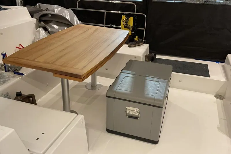 Chicago Yacht Photos Pics Interior of 2020 Lagoon 52 F yacht with wooden table and storage box.