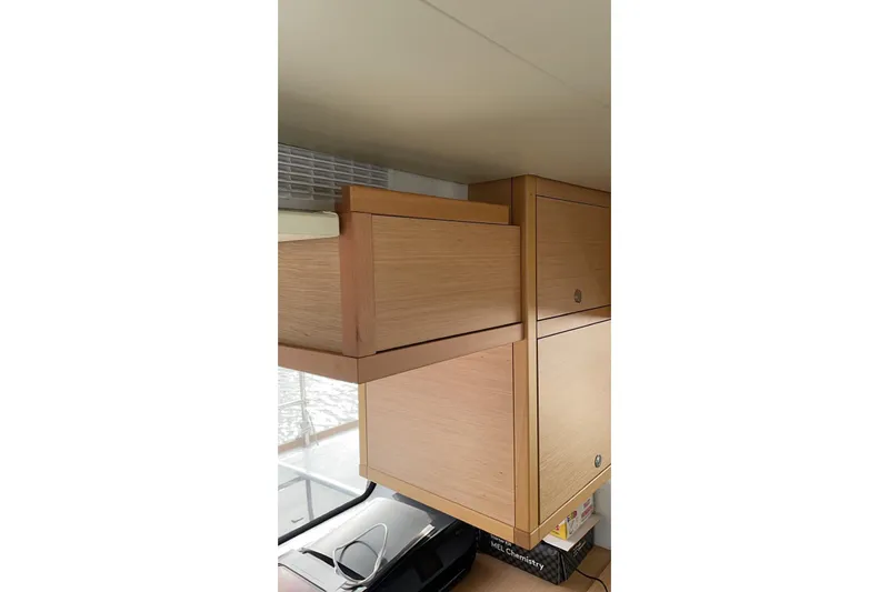 Chicago Yacht Photos Pics Wooden cabinetry inside a 2020 Lagoon 52 F yacht, showcasing sleek design and storage.
