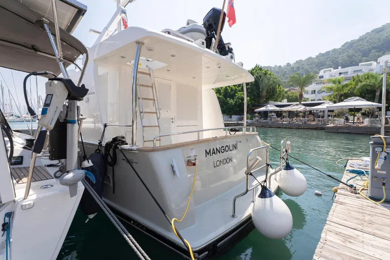  Yacht Photos Pics 2024 Nordhavn 41 yacht docked, featuring sleek design and modern amenities, in a scenic marina.