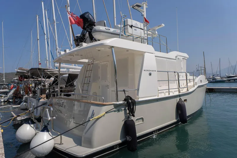  Yacht Photos Pics 2024 Nordhavn 41 yacht docked in marina, featuring sleek design and modern amenities.