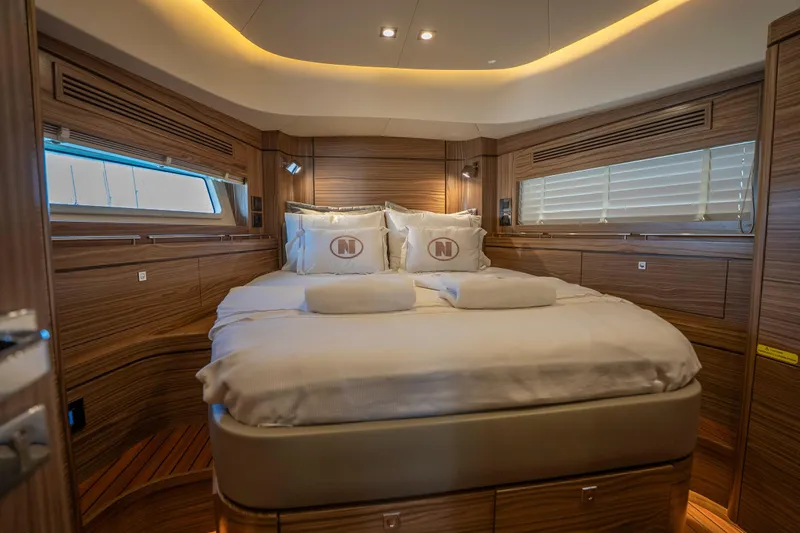  Yacht Photos Pics Luxurious cabin interior of 2024 Nordhavn 41 yacht with elegant wood finish.