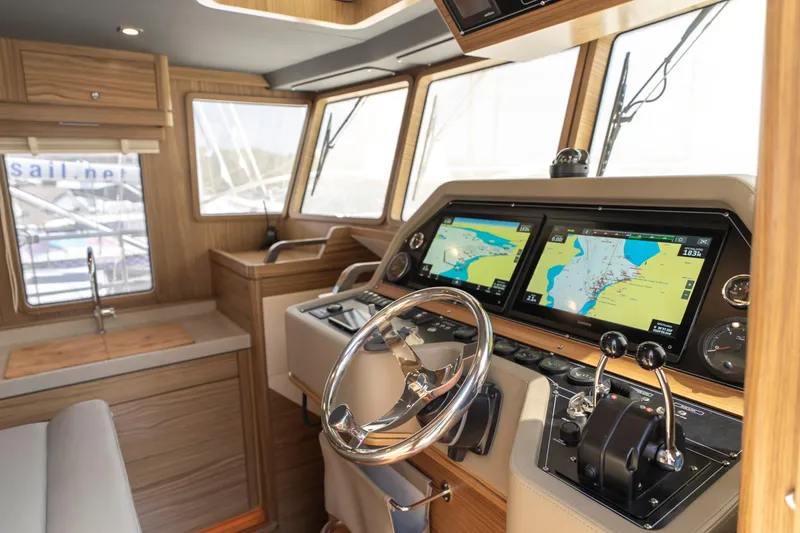  Yacht Photos Pics 2024 Nordhavn 41 yacht interior with modern navigation system and wooden finish.
